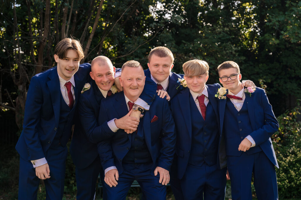 Groom with his groomsmen in the gardens at Portsmouth Register Office, Hampshire