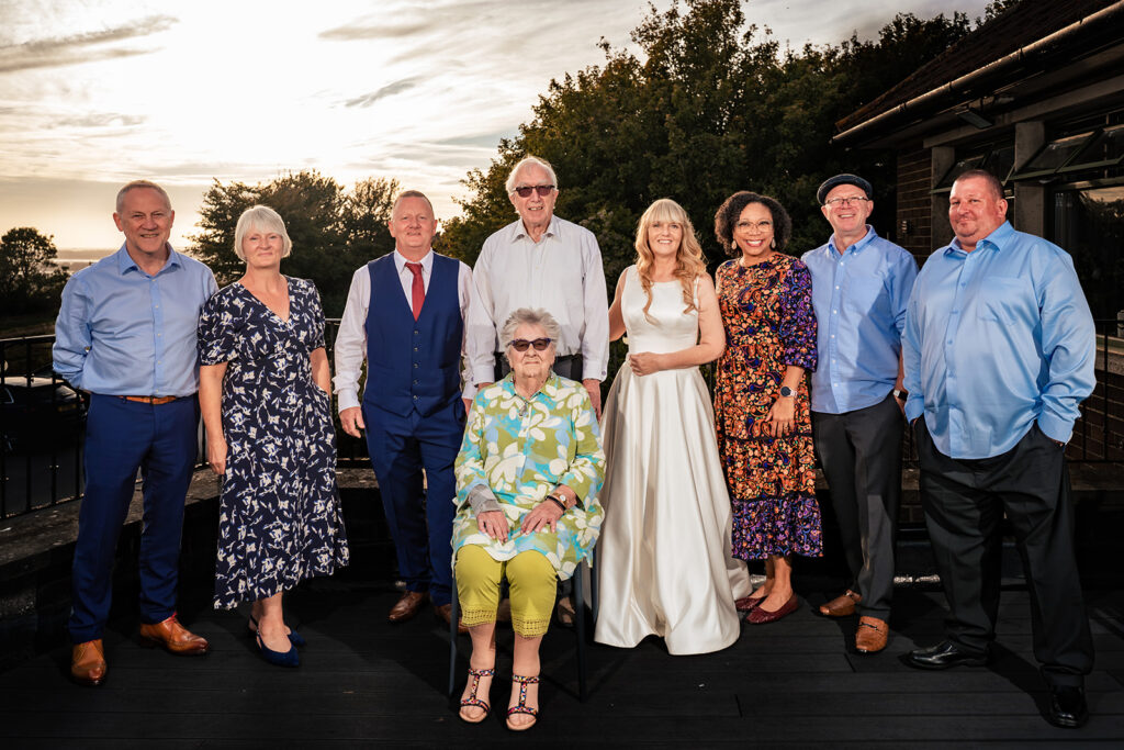 Family group photo on the terrace at sunset at The Churchillian, Portsdown Hill, Portsmouth