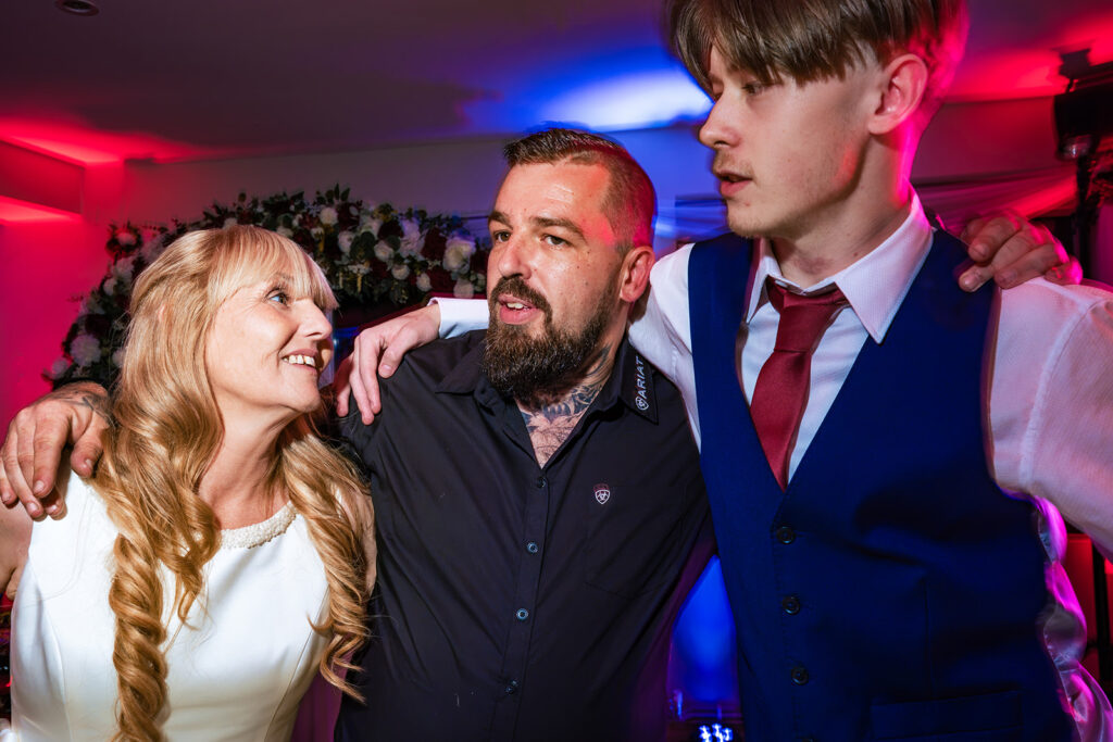 Bride and guests posing on the dancefloor at The Churchillian, Portsdown Hill, Portsmouth