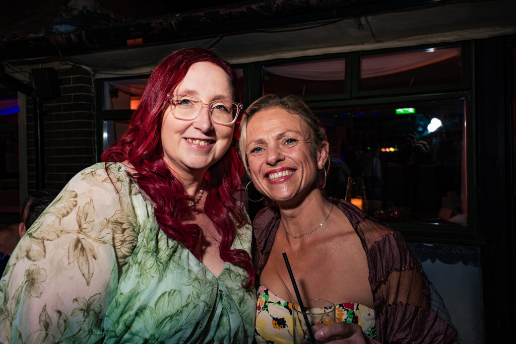 Guests laughing at the evening reception at The Churchillian, Portsdown Hill, Portsmouth