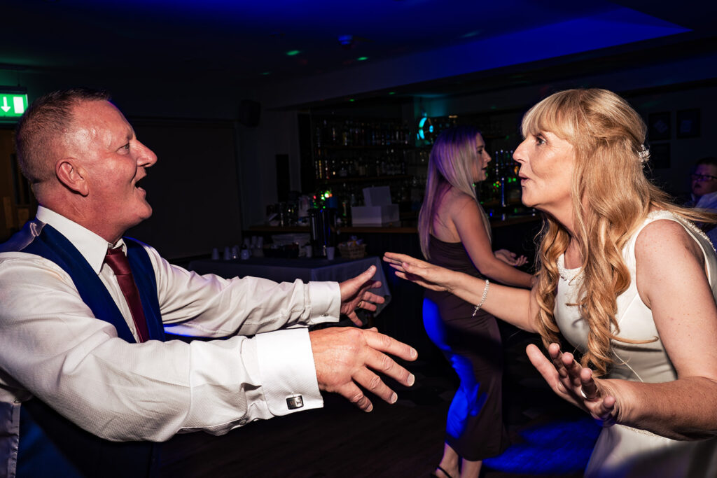 Groom dancing with a guest at The Churchillian, Portsdown Hill, Portsmouth