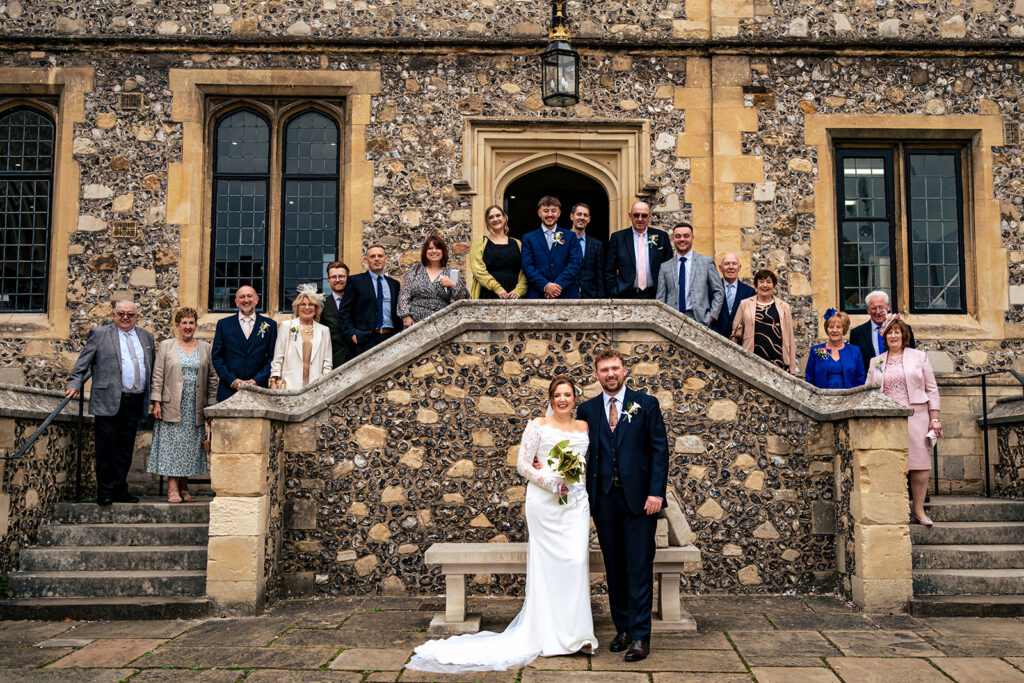 Wedding guests on the steps at Winchester Register Office, Hampshire