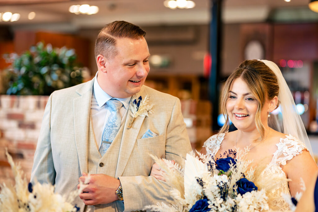 Bride and groom during the ceremony at Old Thorns Hotel and Resort, Liphook