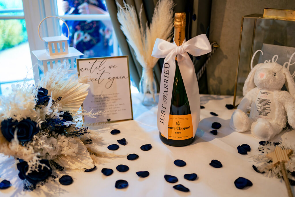 Champagne bottle and table confetti at Old Thorns Hotel and Resort, Liphook