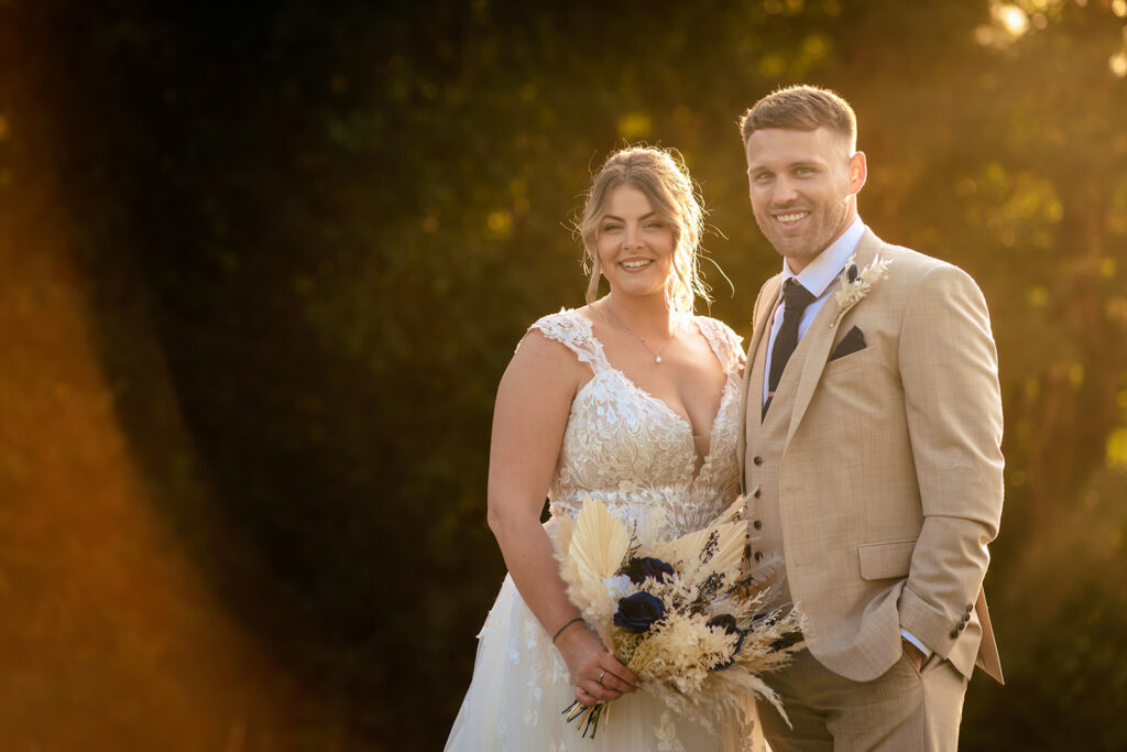 Newlyweds at golden hour at Old Thorns Hotel and Resort, Liphook