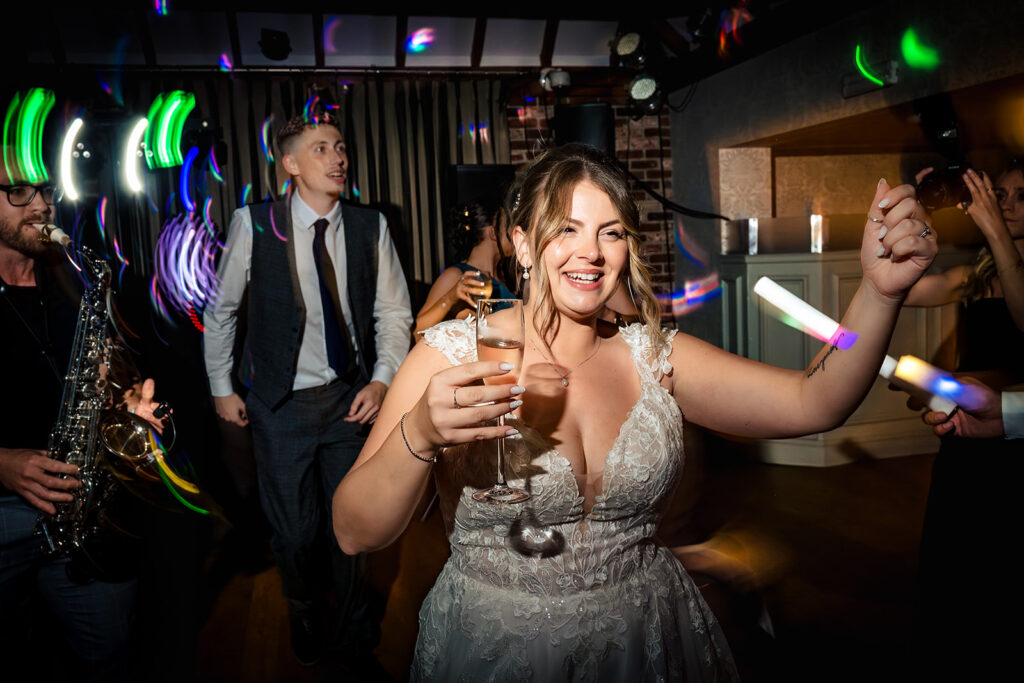 Guest laughing on the dancefloor at Old Thorns Hotel and Resort, Liphook