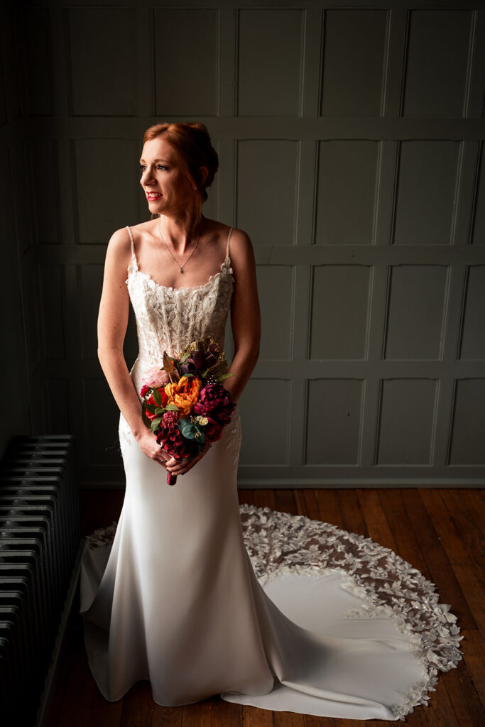 Bridal portrait in the barn doorway at The Post Barn, Newbury