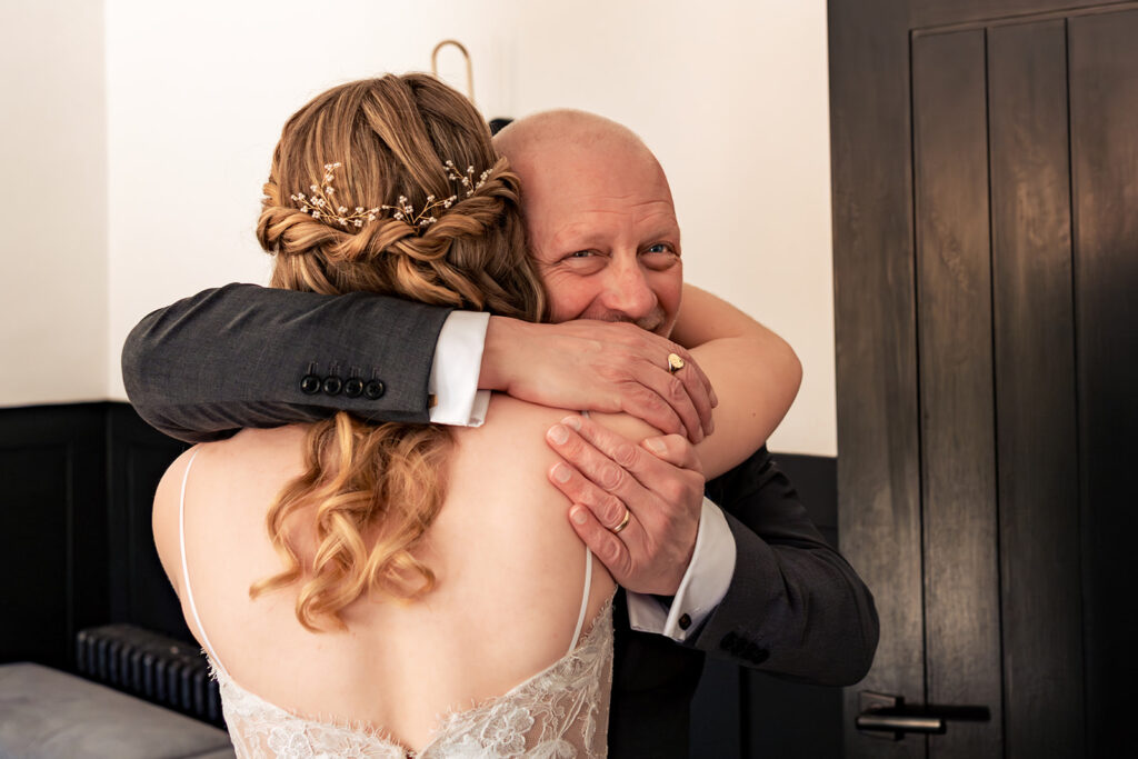 Dad hugging the bride at Royal Military Academy Sandhurst