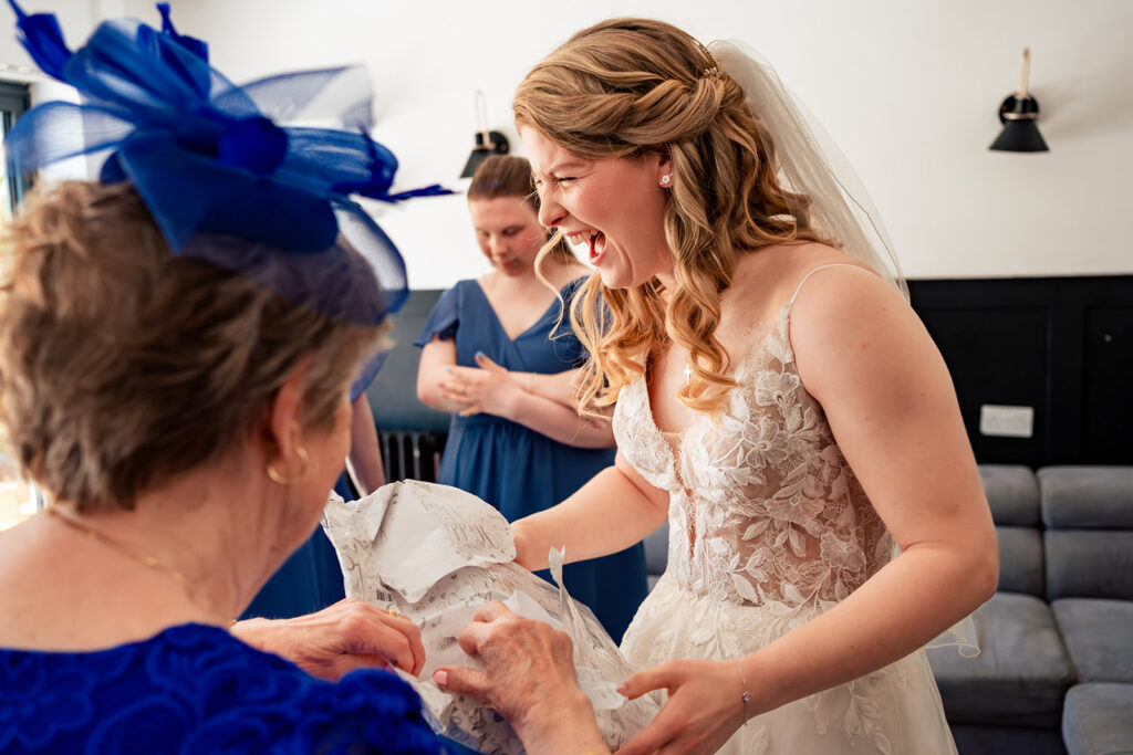Bride laughing during getting ready at Royal Military Academy Sandhurst