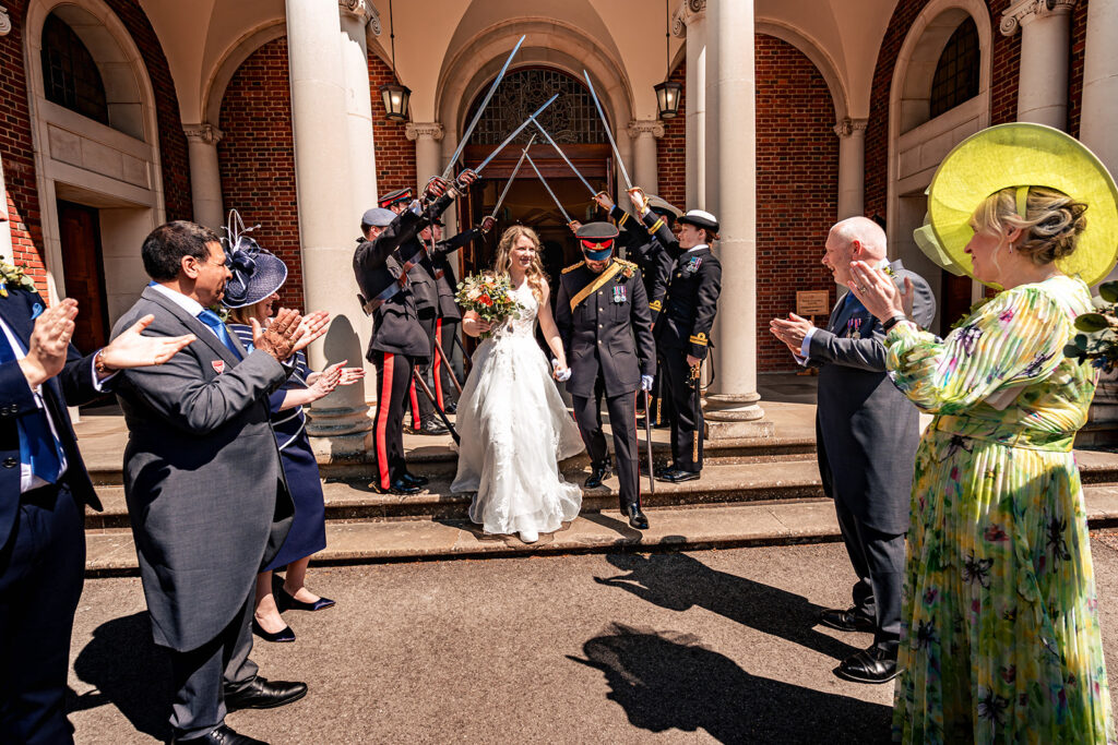 Guests celebrating outside the chapel at Royal Military Academy Sandhurst