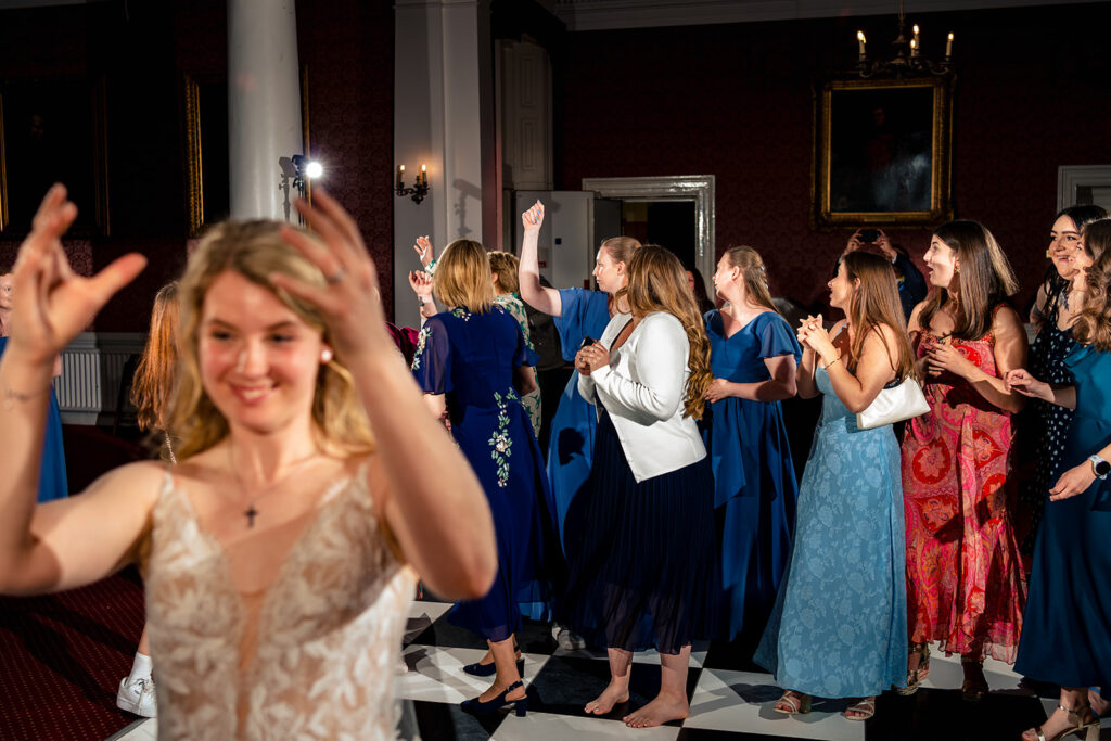 Bride laughing on the dancefloor at Royal Military Academy Sandhurst