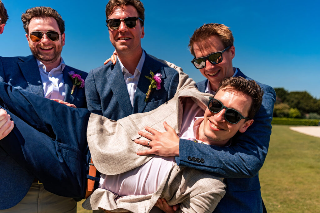 Groom lifted by his mates at Great Ballard School, Eartham