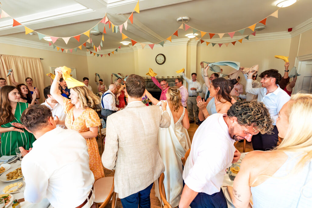 Guests laughing during the speeches at Great Ballard School, Eartham
