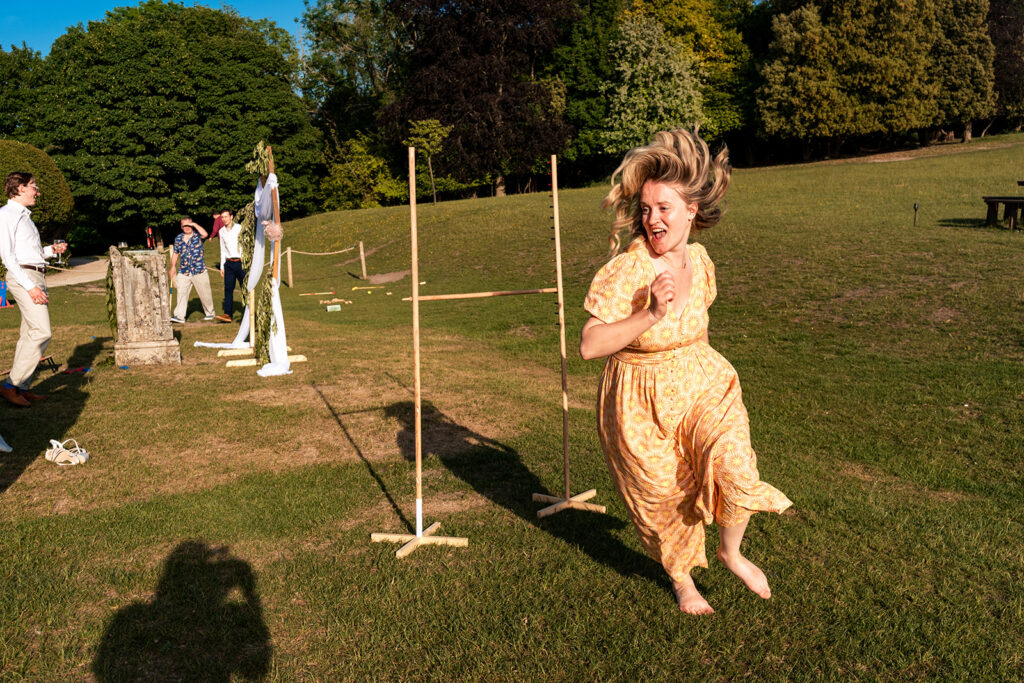Bride on the swing at golden hour at Great Ballard School, Eartham