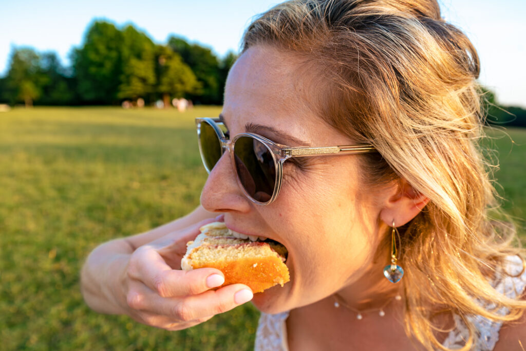 Guest tucking into a burger at Great Ballard School, Eartham