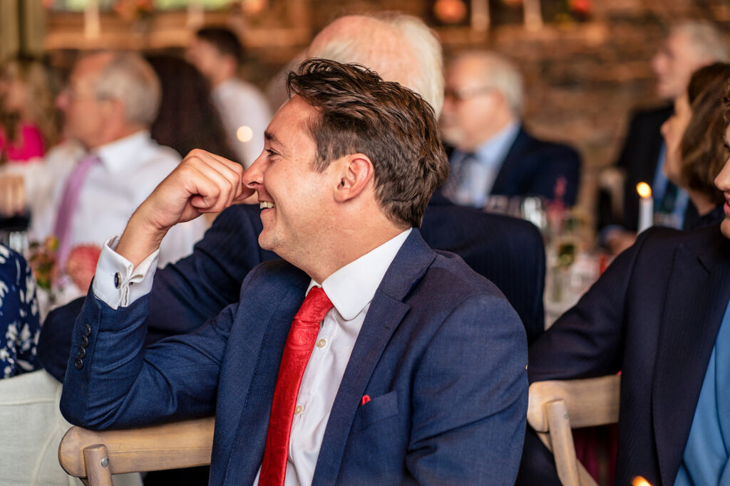 Guests in stitches during the speeches at Dorfold Hall, Cheshire