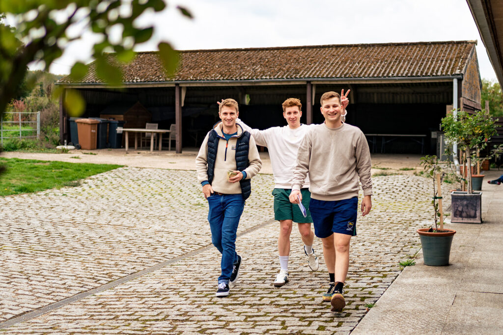 Groom and groomsmen arriving at Houghton Lodge Gardens, Hampshire