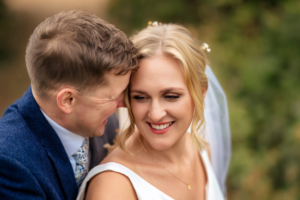 Couple laughing, close up at Houghton Lodge Gardens, Hampshire