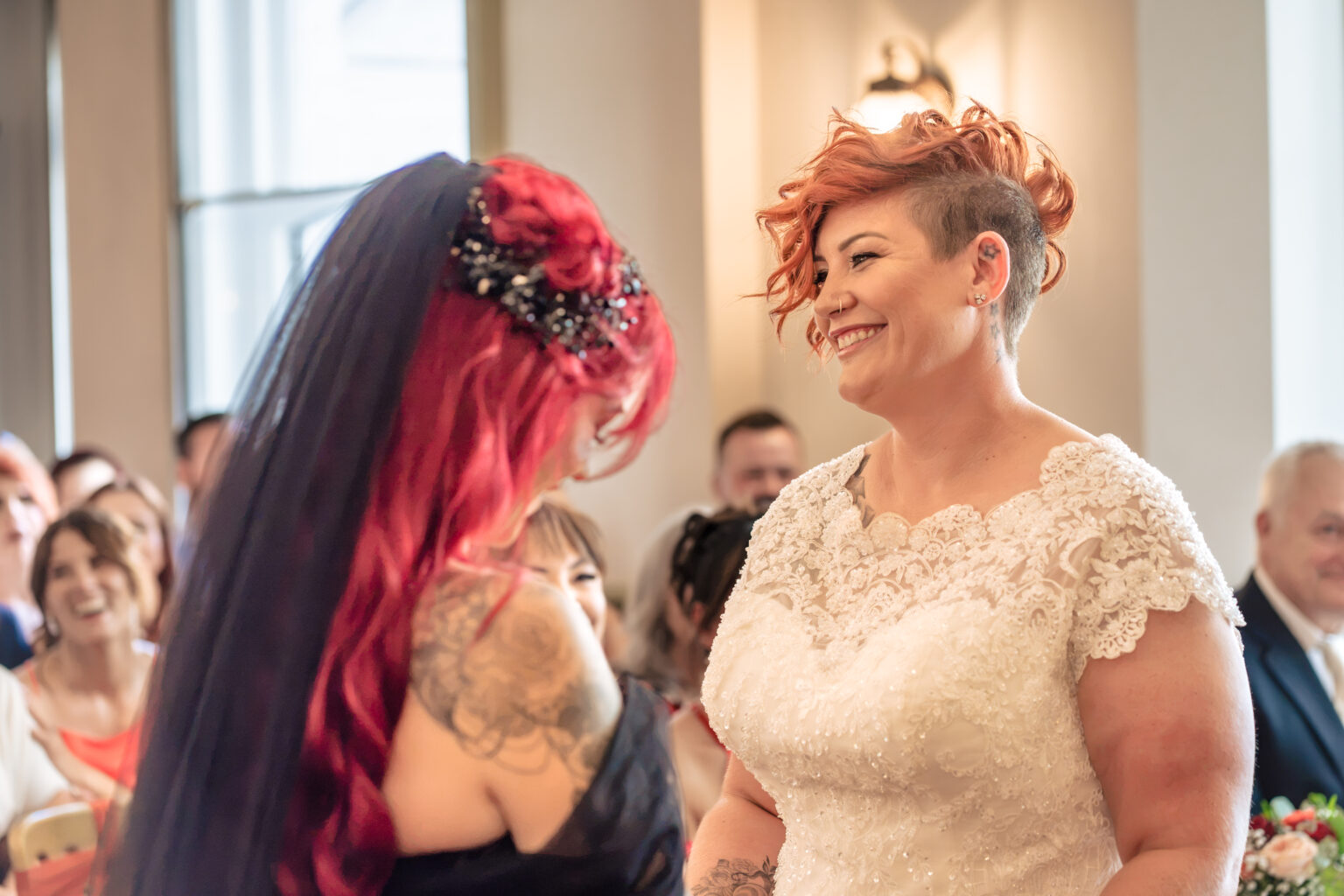 Two brides during their ceremony at The Elephant at Pangbourne without flash, warm and flat light