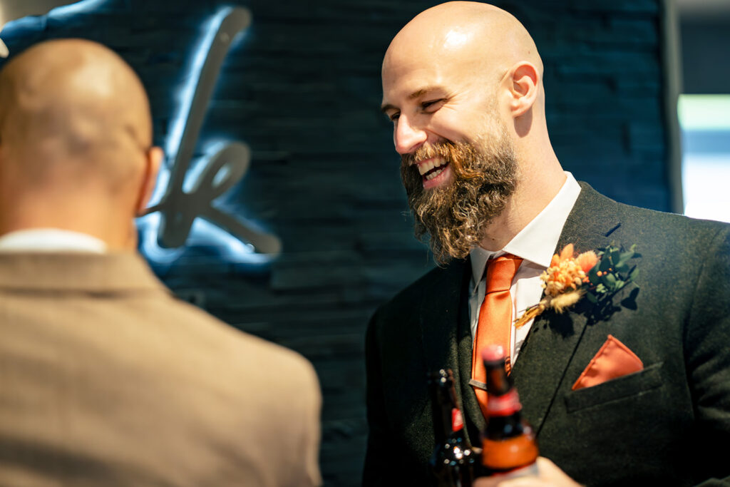 Groom portrait by the window at Skylark Golf and Country Club, Whiteley