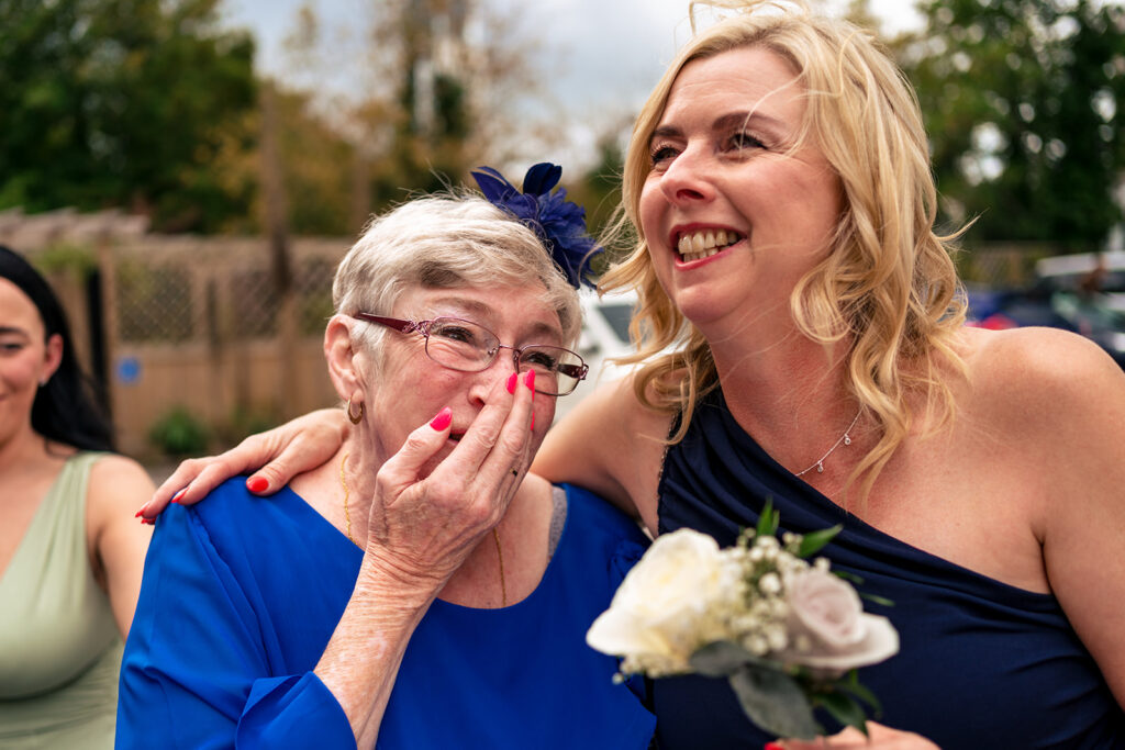 Guests laughing outside Portsmouth Register Office