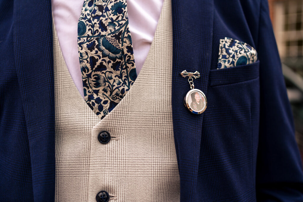 Groom’s waistcoat, tie and buttonhole detail