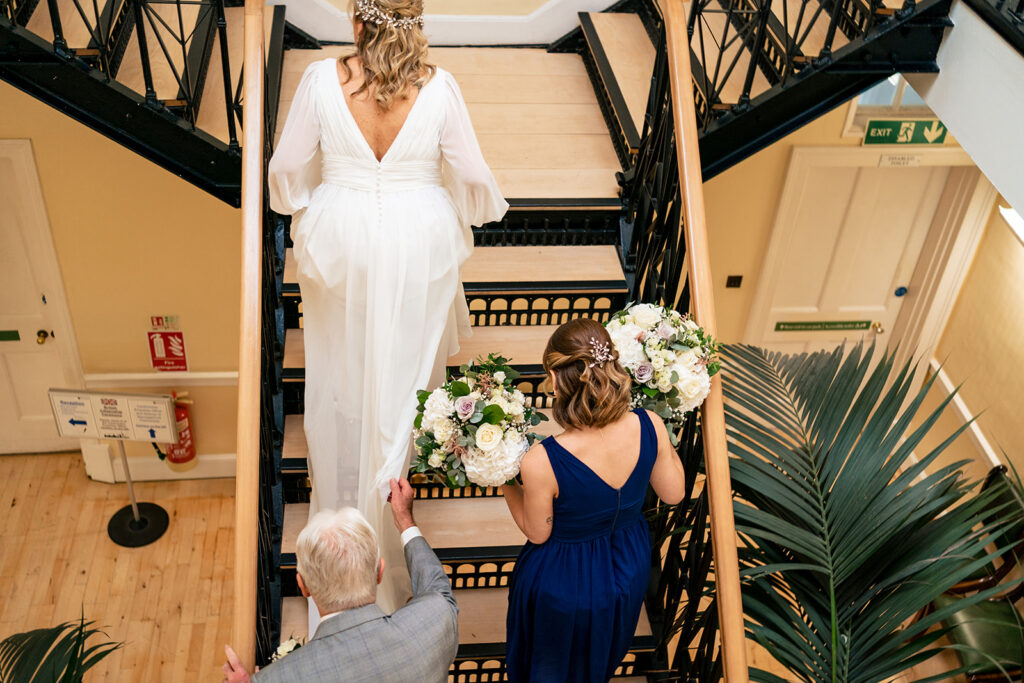 Bride walking down the stairs at Portsmouth Register Office
