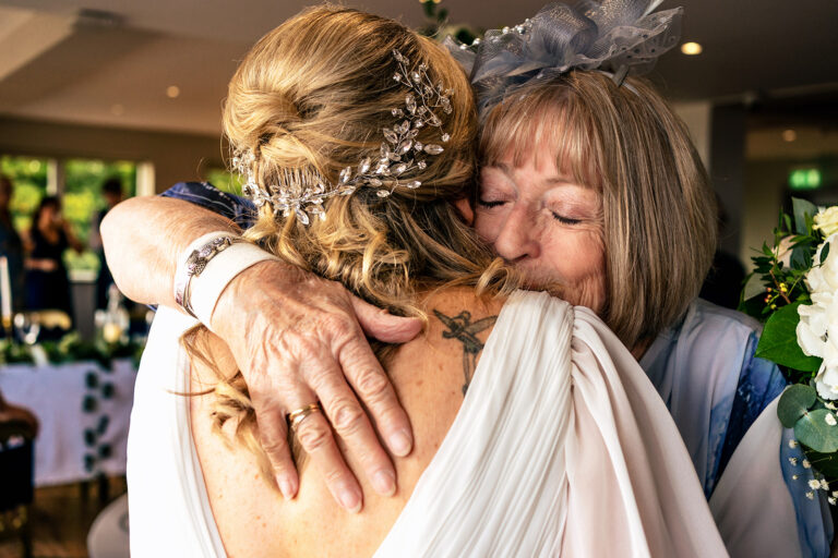 Bride hugging her mum