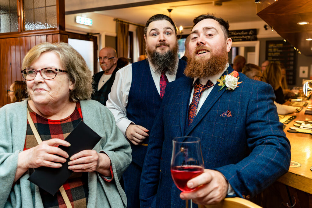 Groom and his best man sharing a drink at Halloween micro wedding, Southampton