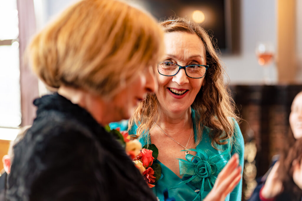 Bride laughing with a guest at Halloween micro wedding, Southampton