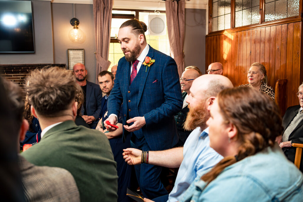 Guests in the cosy pub at Halloween micro wedding, Southampton