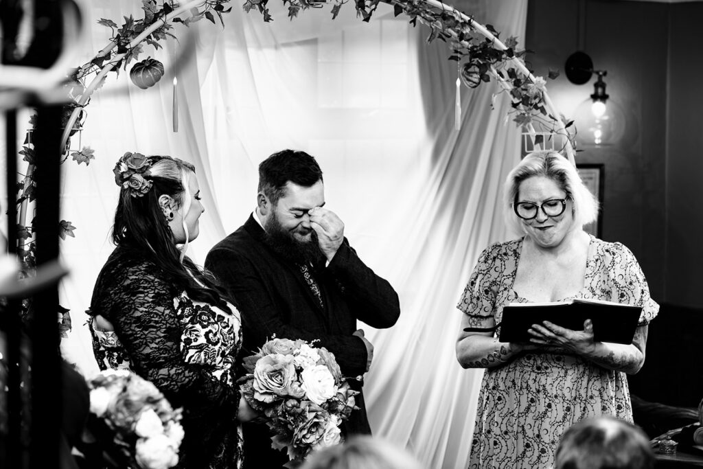Ceremony moment, black and white at Halloween micro wedding, Southampton