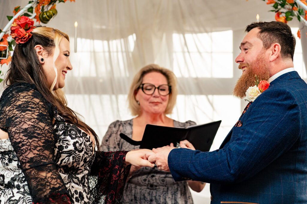 Exchanging rings at Halloween micro wedding, Southampton