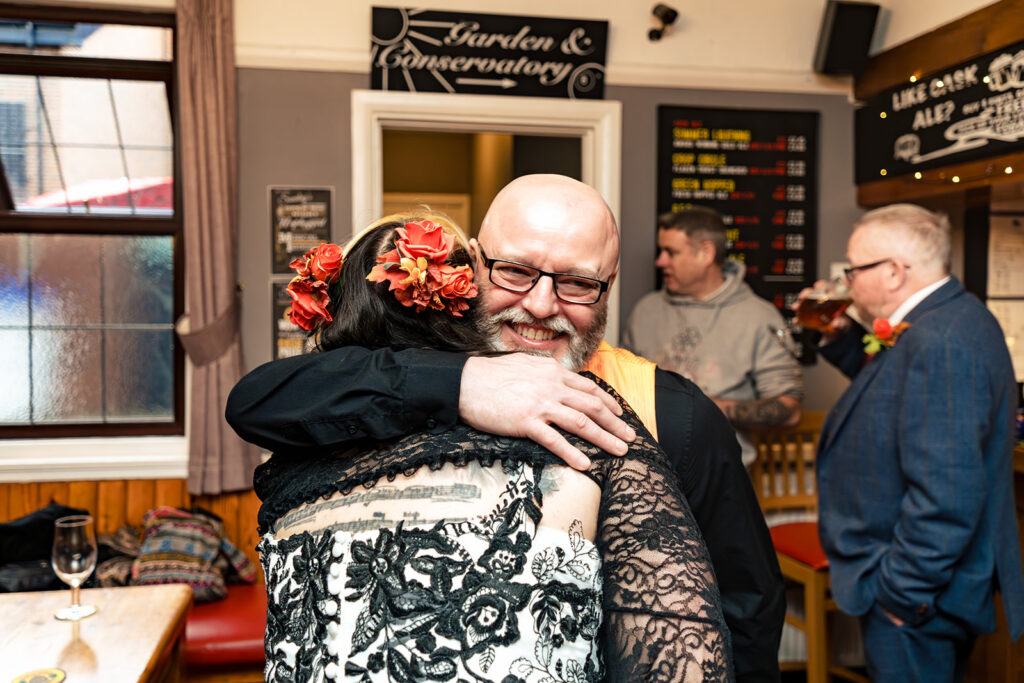 Hugs after the ceremony at Halloween micro wedding, Southampton