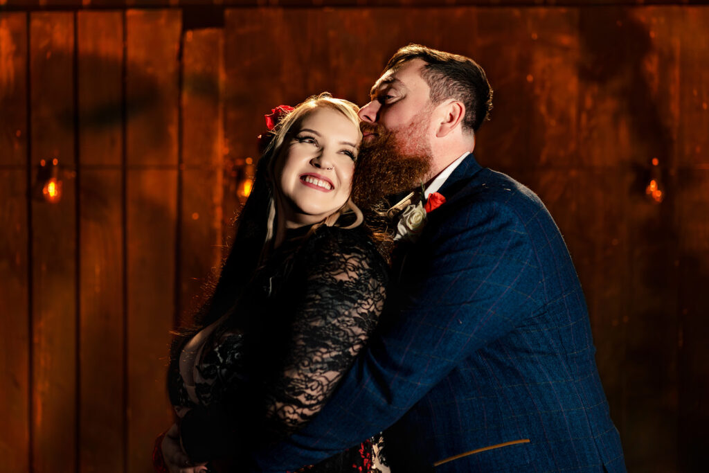 Couple kissing in the warm light at Halloween micro wedding, Southampton