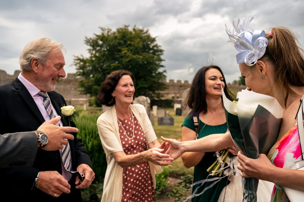 Guests greeting each other outside the church at St Mary’s Church, Portchester