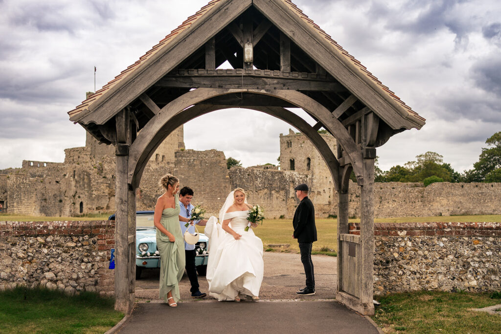 Bride arriving through the lychgate at St Mary’s Church, Portchester