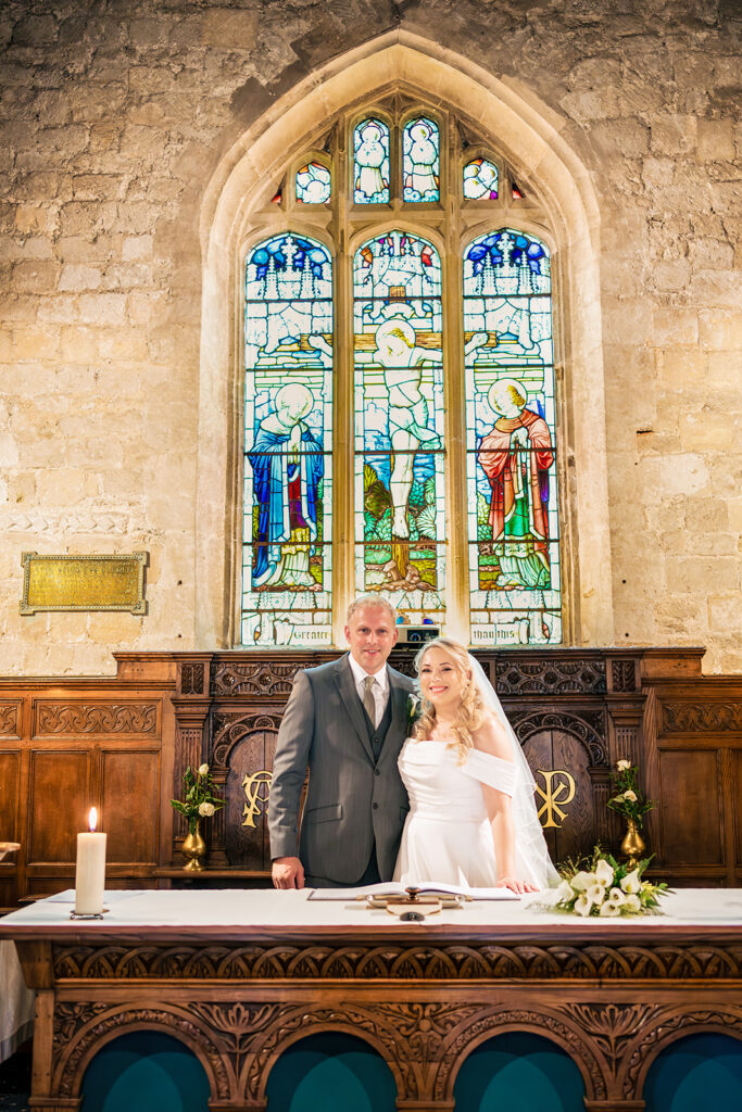 Ceremony at the altar beneath the stained glass window at St Mary’s Church, Portchester
