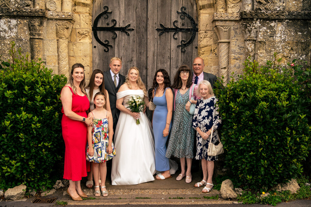 Family group photo at the church door at St Mary’s Church, Portchester