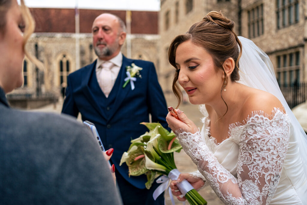 Bride laughing with the groom outside at Winchester Register Office