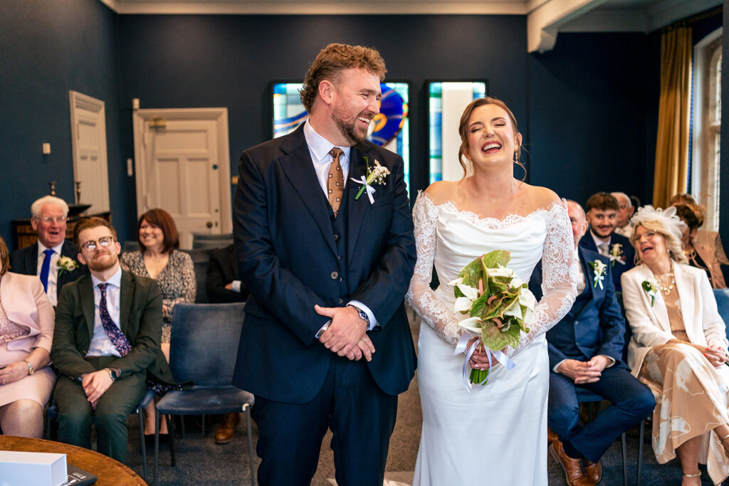Bride and groom at the front of the ceremony room at Winchester Register Office