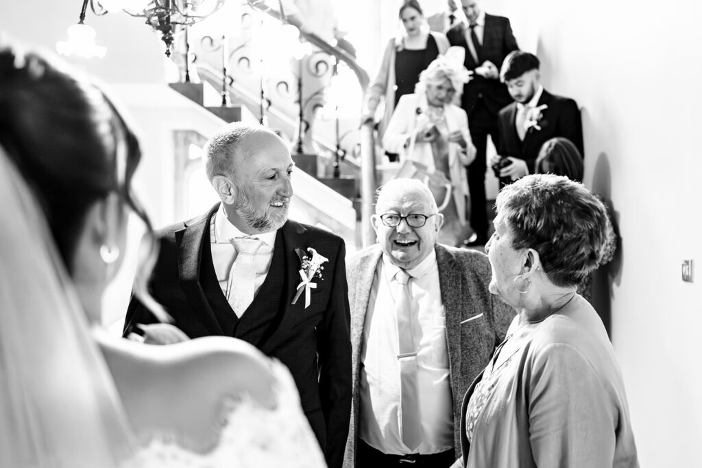 Hugs after the ceremony, black and white at Winchester Register Office