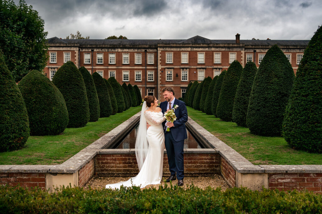 Couple in the formal gardens at Winchester Register Office