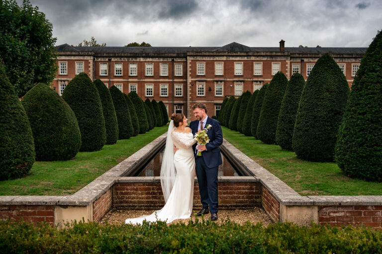 Couple in the formal gardens at Winchester Register Office