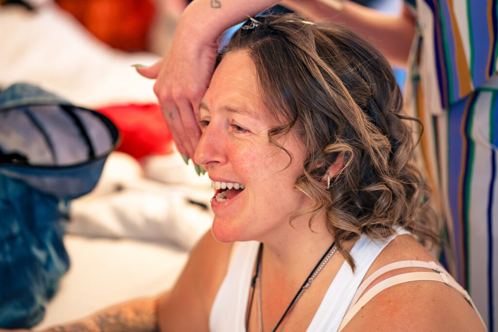 Bride laughing during getting ready