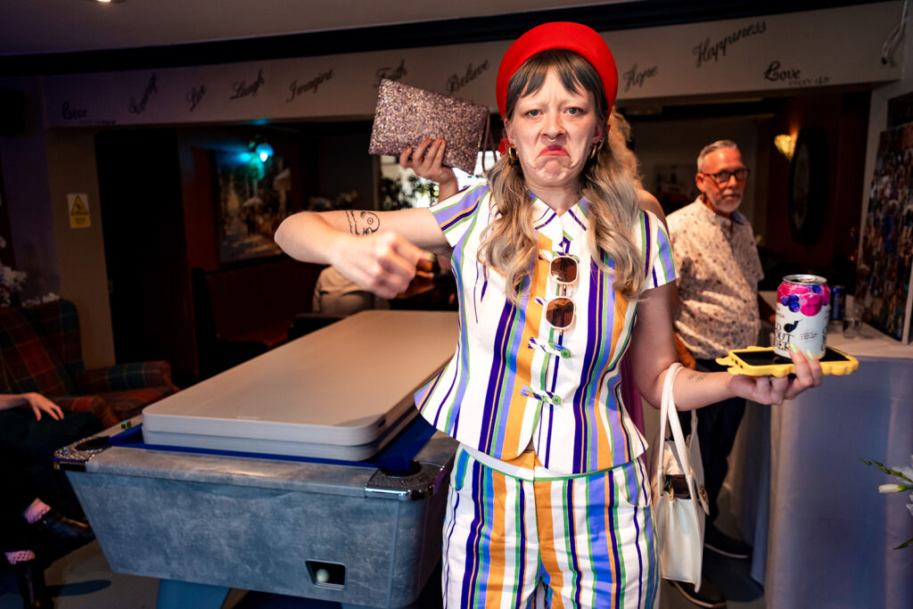 Guest in a colourful outfit at Ashbys
