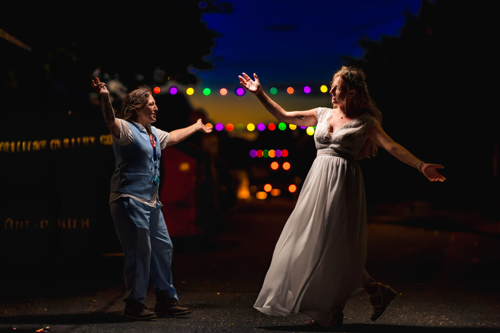 Bride dancing at night with flash