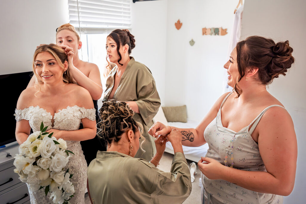 Bride with her bridesmaids before the ceremony at Newtown House Hotel, Hayling Island
