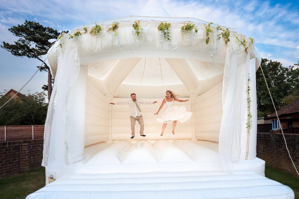 Couple on the white bouncy castle at Newtown House Hotel, Hayling Island