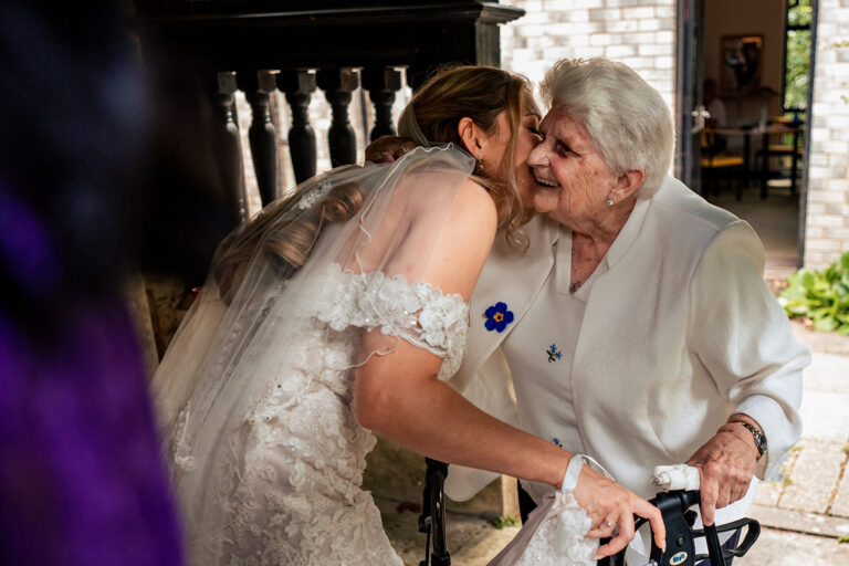 Bride hugging a guest at Newtown House Hotel, Hayling Island